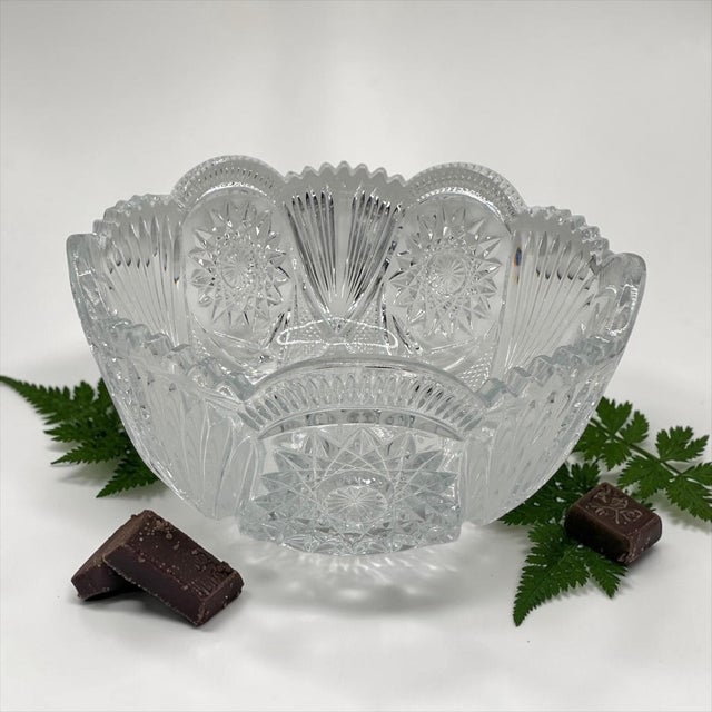 A stunning, highly detailed vintage cut crystal centerpiece bowl. This heavy lead crystal piece draws beautifully from the...