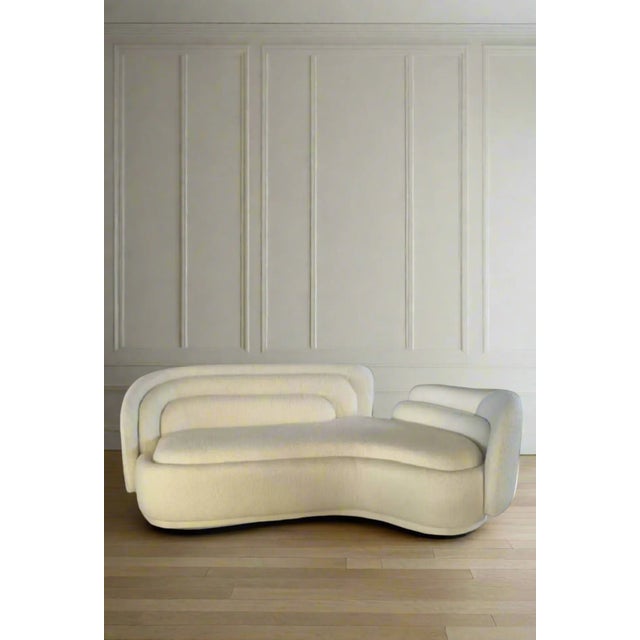 Upgrade your living space with the sleek and stylish Bernard Curved Sofa. This trendy white sofa with boucle fabric...