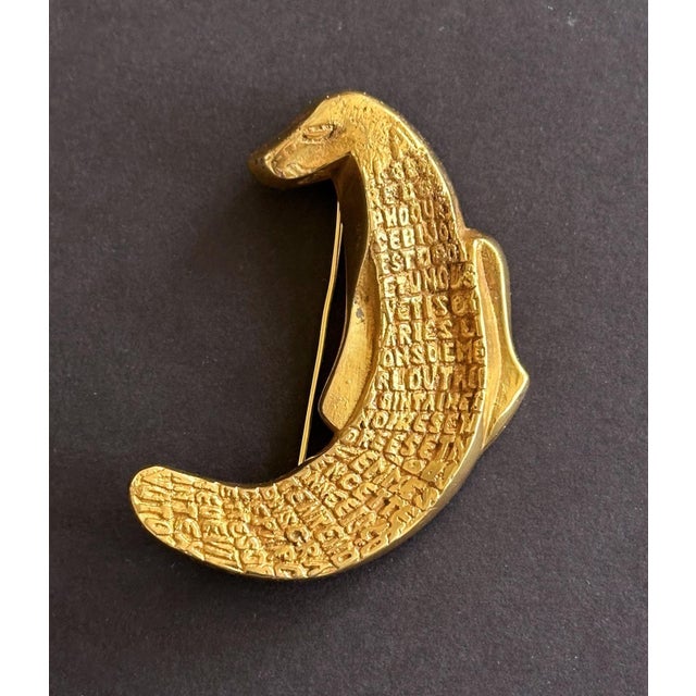 A bespoken bronze brooch by French Parisian art jeweler Line Vautrin (1913-1997) circa 1946 named "À La Gloire des...