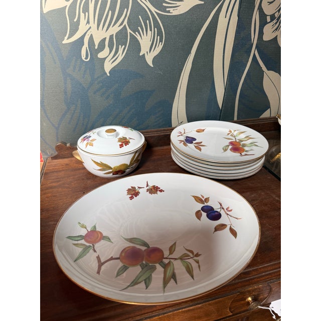 A set of six elegant dessert plates from the renowned Royal Worcester "Evesham Vale" pattern. Crafted in fine porcelain,...