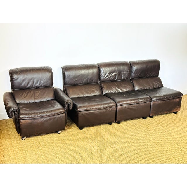 Complete living room set, modular leather sofa consisting of a 3-piece bench and an armchair dating from the 1970s. german...