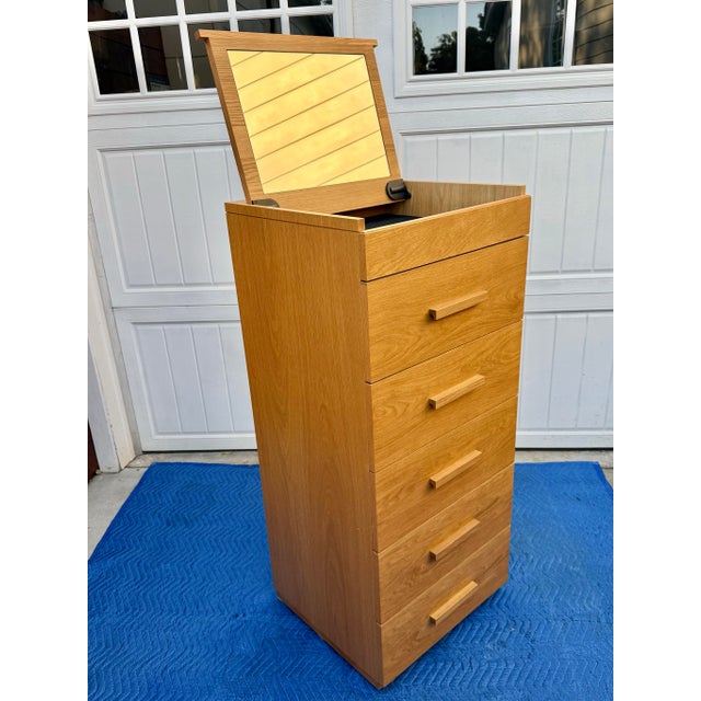 Contemporary Modern oak dresser with a flip-up mirror that folds into the top. on the top of the chest. Very simple and...
