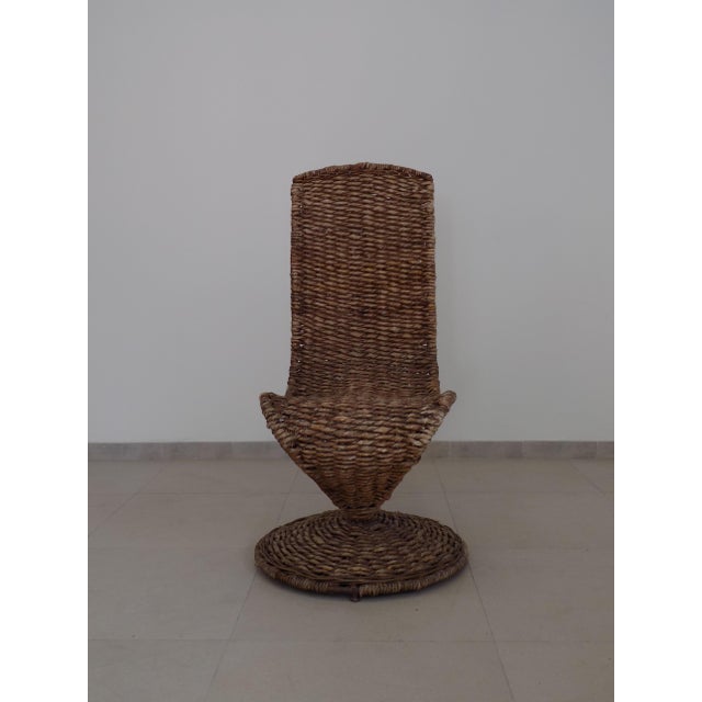 Iconic chair by Marzio Cecchi for Studio Most, metal frame and handcrafted banana leaf covering. This piece has an...