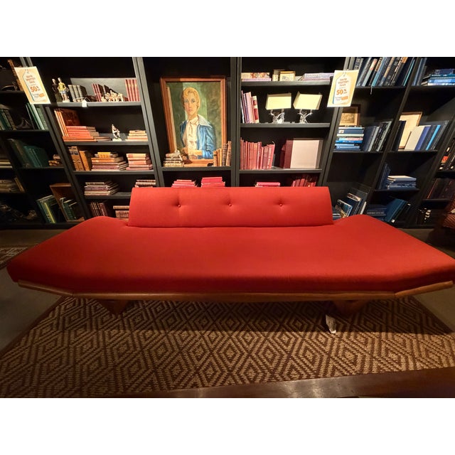 An iconic and highly sought-after Mid-Century Modern "Gondola" sofa. This striking, low-profile statement piece...