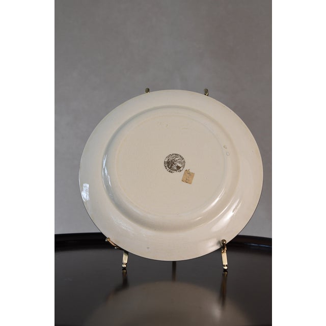 Designed by Charles Noke, the Gallant Fishers Series were created in England between 1900-1930s. This plate depicts a...