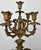 An impressive Antique French brass candelabra featuring five arms, elaborate scrolling forms and richly detailed floral...