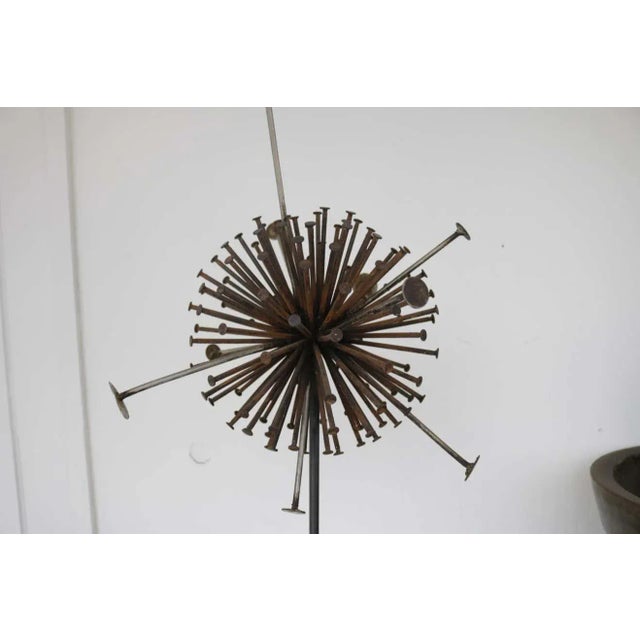 This brutalist metal round sculpture has an amazing patina and a very modern feel. The piece, composed of rusted nails,...
