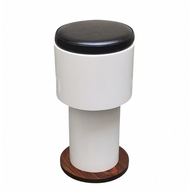 Bar stool: a piece of Italian design from the 1960s, featuring a double cylinder structure in white lacquered wood with a...