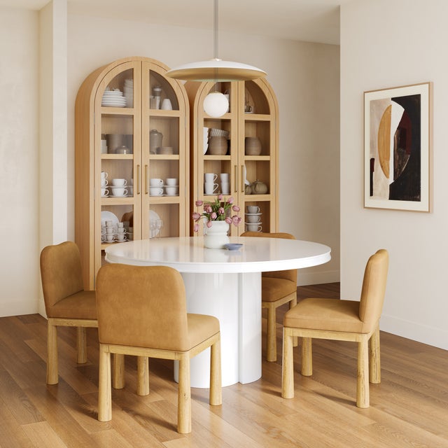 The Elora Lacquer Round Dining Table combines contemporary design with effortless elegance, featuring a sleek lacquer...