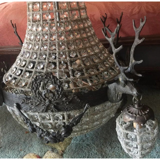 Up for consideration is a beautiful pair of Hollywood regency large chandeliers with deer accents. These pieces would look...