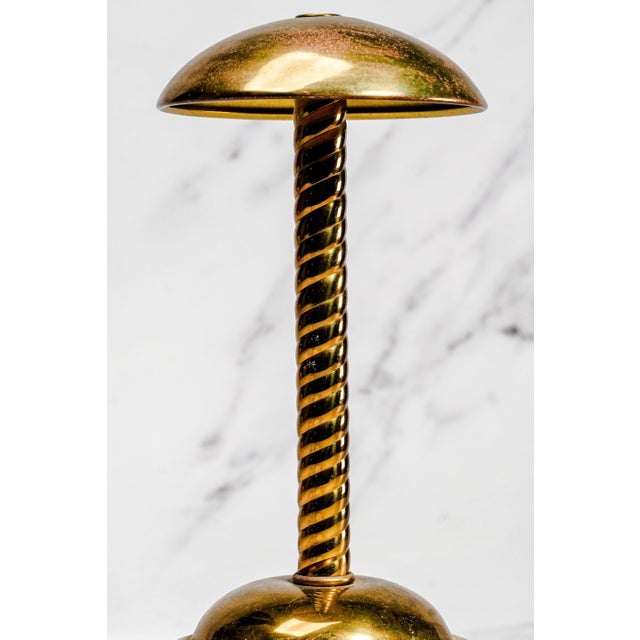A handsome expression of mid-century elegance, this distinctive vintage brass hat stand, dating to approximately the...
