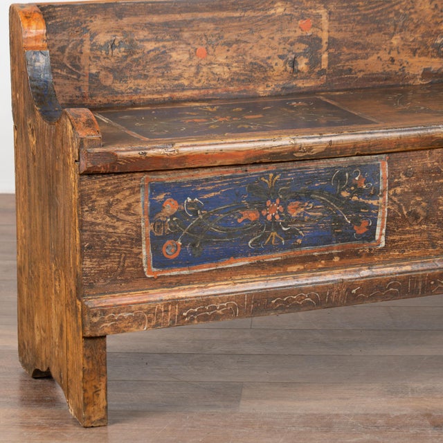 Antique hand painted long pine bench is embellished with traditional Eastern European folk art painting with blue accents...