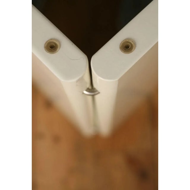 Lacquered wood and glass slab coffee table, France, circa 1980. Glass stripes on the corners. 2-part base. Solid and...