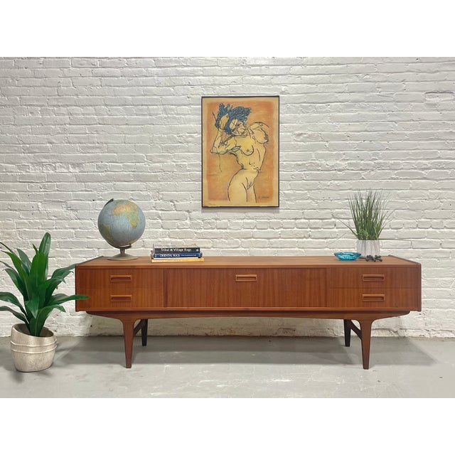 Designed and crafted in Denmark in the 1960s by P. Westergaard’s Møbelfabrik, this exceptional mid century modern credenza...
