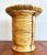 This woven rattan vessel features a striking hourglass silhouette with bands of tightly coiled cane held in place by...