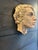 Hand sculpted head made of earthenware. I found this at an estate sale hanging on an outside wall. It has a lovely patina....