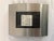 New, never used Nambe convex photo frame Circa 1990’s Measures 8” x 6” Holds a 4.5” x 3” photo Hallmarked on back (see...