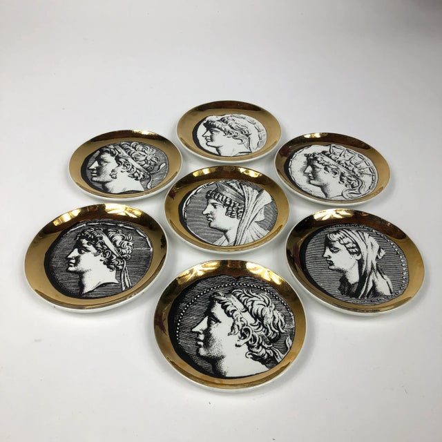 Set of Seven Gilded Porcelain Coasters by Piero Fornasetti
