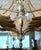 Hollywood Regency Italian 1960s Gilt-Metal and Tole 7-Light Chandelier With Crystal Flowers & Foliage Stems For Sale - Image 3 of 10