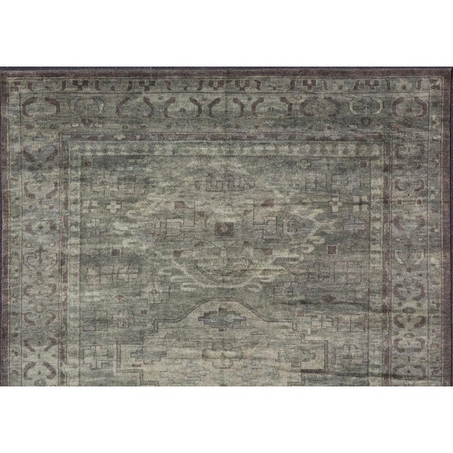 Keivan Woven Arts Large Modern Khotan Rug 12' x 15' Measures 12'0 x 15'0 The border has tribal markings in a rich green...