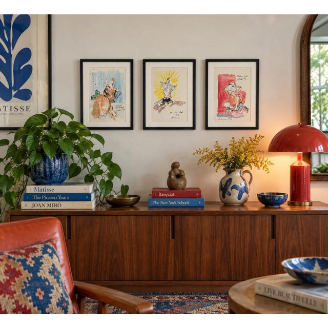 A compelling and deeply personal collection of three signed figurative ink and watercolor works attributed to “Lawrence,”...