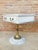 Elegant pair of neoclassical nightstands, each featuring a square top with a single drawer. The wooden structures are...