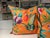 Pair of 22" X 22" Orange Botanical Manual Canovas down filled pillows with beaded trim.
