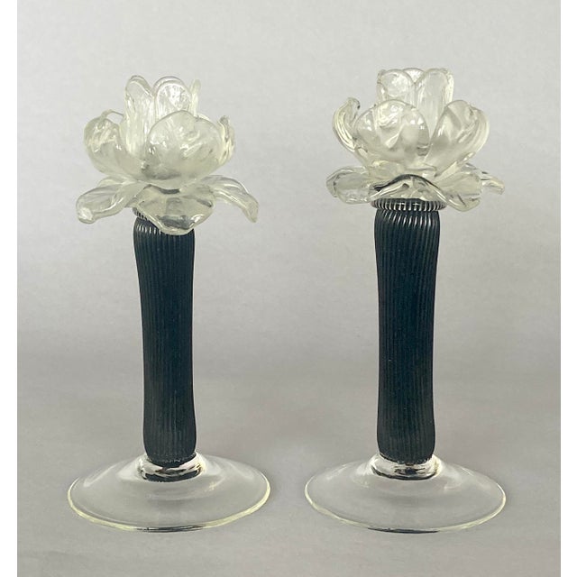 Offering two pairs of exceptional vintage Italian art-glass candlesticks featuring sculptural clear glass flowers atop...