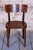 This set of 4 chairs is a magnificent and highly aesthetic showcase of furniture design from the transitional period...