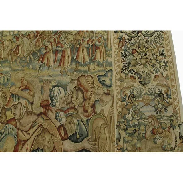 Handwoven recreation of a 16th century tapestry featuring a celebration of battle accented in shades of gold, sage and...