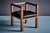 Elegant Art Deco armchair made of solid oak with carved details and a black leather seat cushion. The chair features...