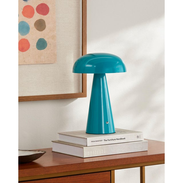 Illuminate your space with the chic and portable Umbra accent table lamp, a beacon of minimalist modern style. Standing at...