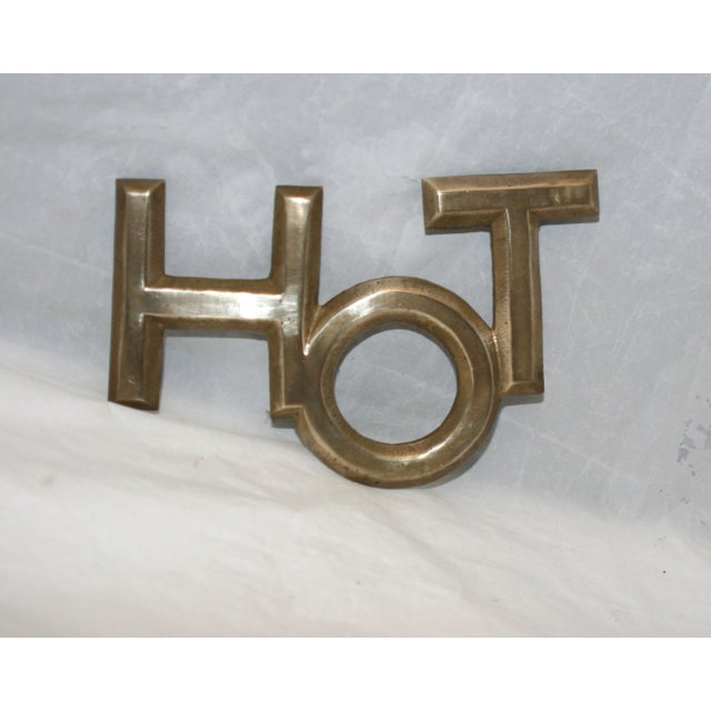 Metal 1960s Mid Century Modern Brass Beveled Edge Footed Hot Word Shaped Trivet For Sale - Image 7 of 8