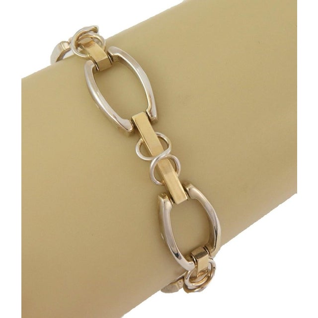 The Open Design 14k Two Tone Gold Link Bracelet is a stylish piece of vintage and antique jewelry. Made of high-quality...