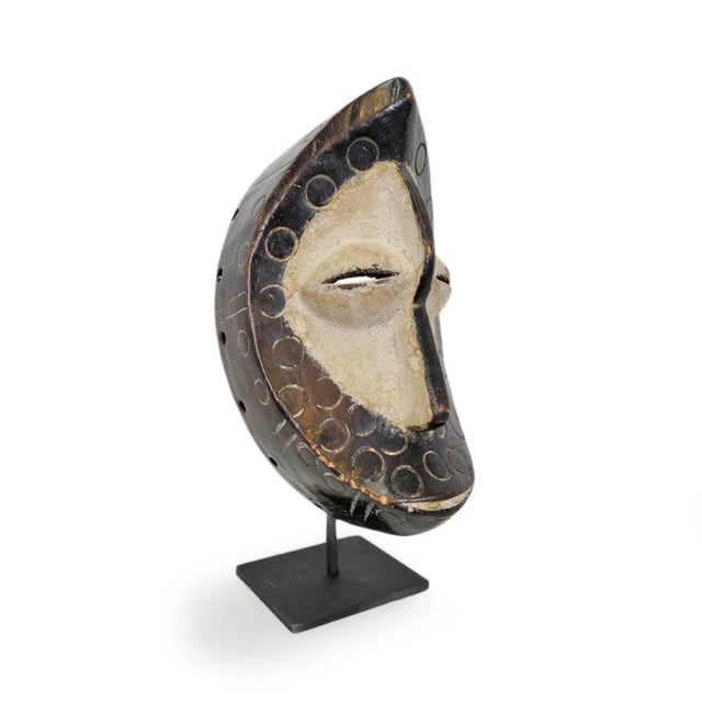 Original Lega passport mask from Democratic Republic of Congo. Unique crest shaped face. Traditionally used as...