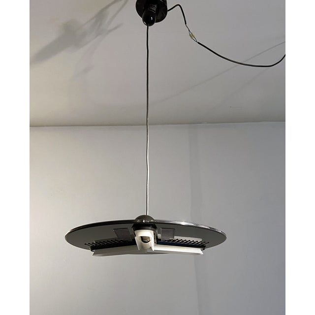 Tristras model pendant lamp from 1986 produced by Arteluce designers Perry King & Santiago Miranda. Black plastic...