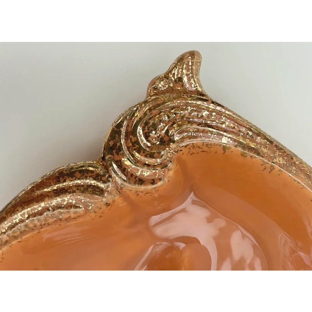 Lovely coral colored feminine style California Pottery ashtray with gold detailing. Color is similar to Pantone 1565...