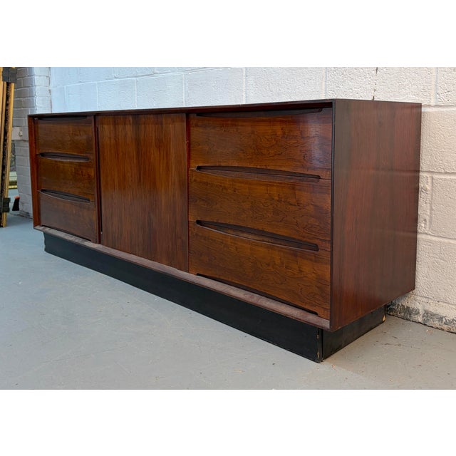 Exceptional Mid-Century Modern credenza by Dyrlund of Denmark, a name synonymous with superior Danish craftsmanship and...