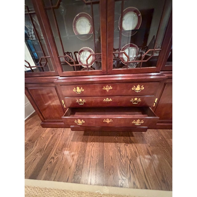 Classic Henredon China Closet offers 4 door breakfront, 2 lower cabinets and 4 drawers.