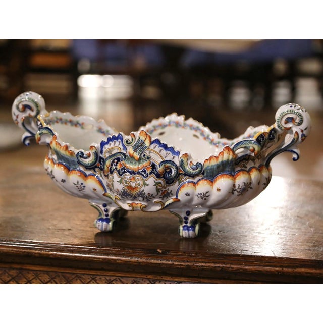Crafted in Rouen, France circa 1940, the antique ceramic planter sits on escargot feet over a scalloped apron. The oblong...