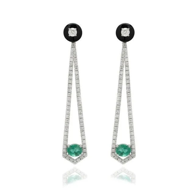 This is part of Chairish’s Fine Jewelry assortment. Designer Emerald and Diamond Long Dangle Earrings to make a statement...