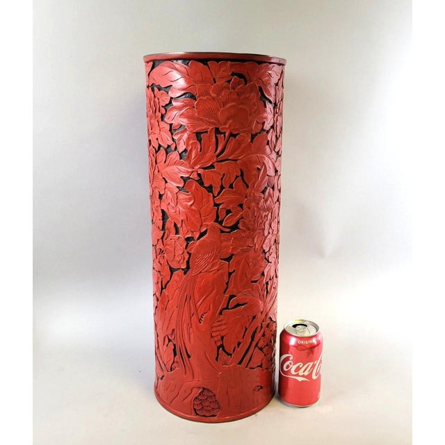 A striking large-scale cinnabar-style lacquer floor vase or umbrella stand, produced by the Beijing Lacquer Factory in the...