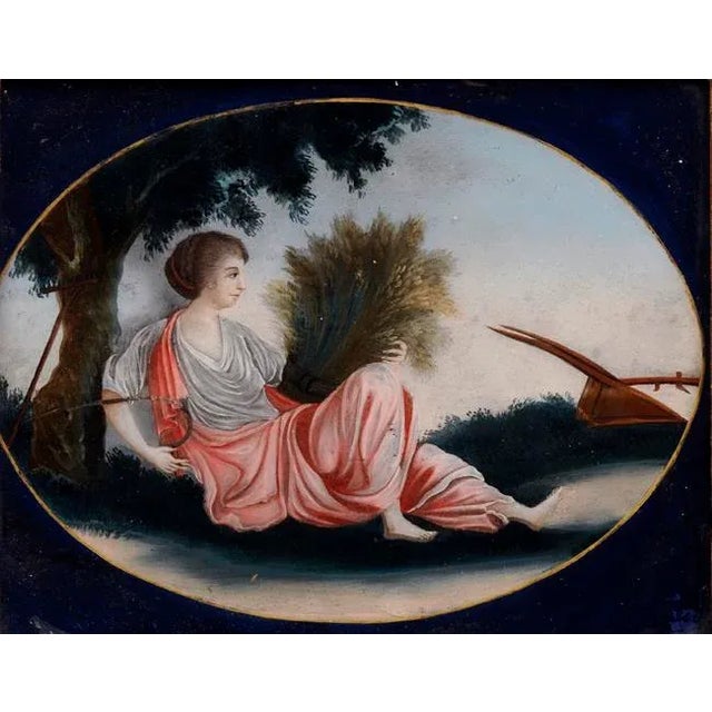 China trade reverse glass painting of Ceres, goddess of the “Harvest,” leaning against a tree holding a sheath of wheat...