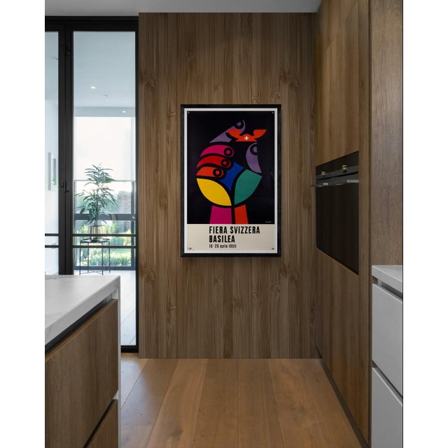This original 1955 exhibition poster promotes the Fiera Svizzera Basilea (Swiss Fair Basel), designed by the renowned...