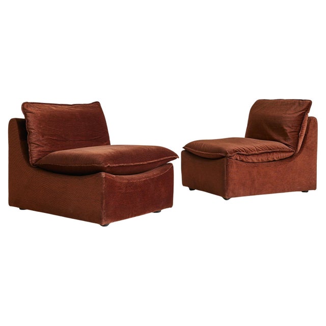 Sold and priced individually. A 1970s Italian lounge chair with deep, low-slung proportions and soft corduroy upholstery...