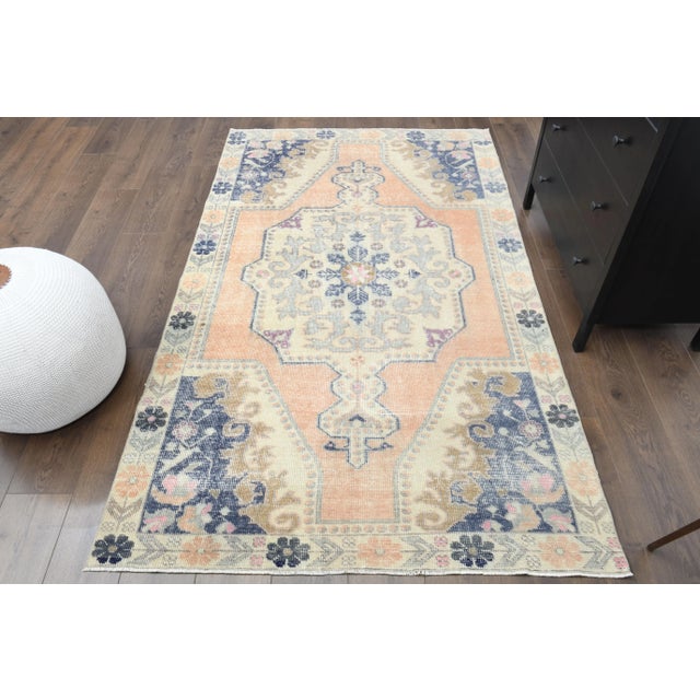 Vintage Turkish Hand-Knotted vintage rug is a semi-antique vintage Area rug.'70s Eastern region of Turkey's unique rug is...