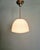 Bauhaus pendant light in chromed metal with a white opaline glass shade, 1930s. The pendant light has been rewired and is...