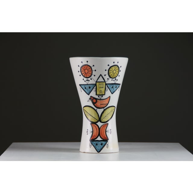 Large ceramic vase in a diabolo shape, created by Roger Capron in Vallauris in the 1950s. It features a graphic design...