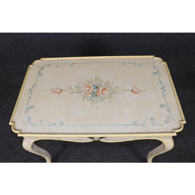 This elegant Louis XV style painted writing table or petite desk embodies the graceful sophistication of 18th-century...