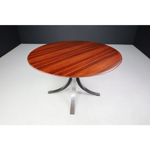 Osvaldo Borsani and Eugenio Gerli for Tecno round dining table in Walnut and Steel Italy, 1965. This is a round dining...